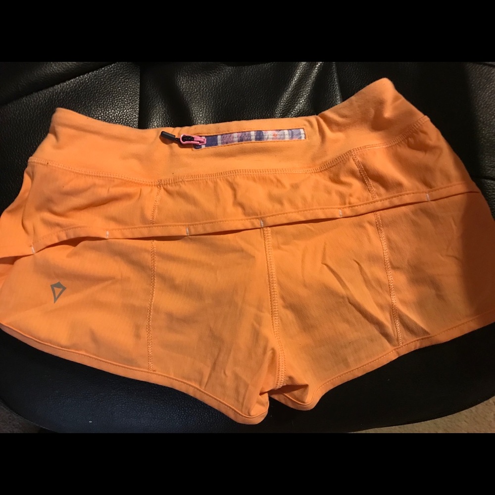 Lululemon Ivivva Orange cream shorts